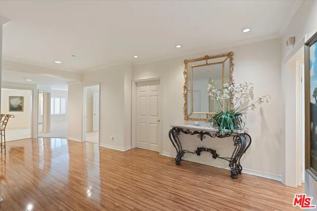 a view of a livingroom with furniture and a potted plant