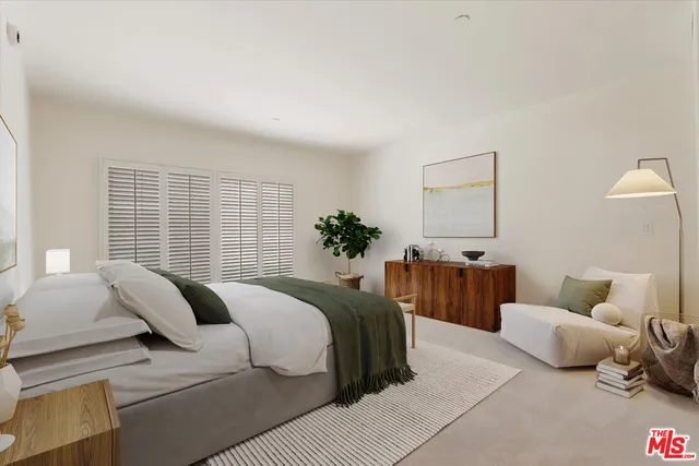 a bedroom with a bed and a couch