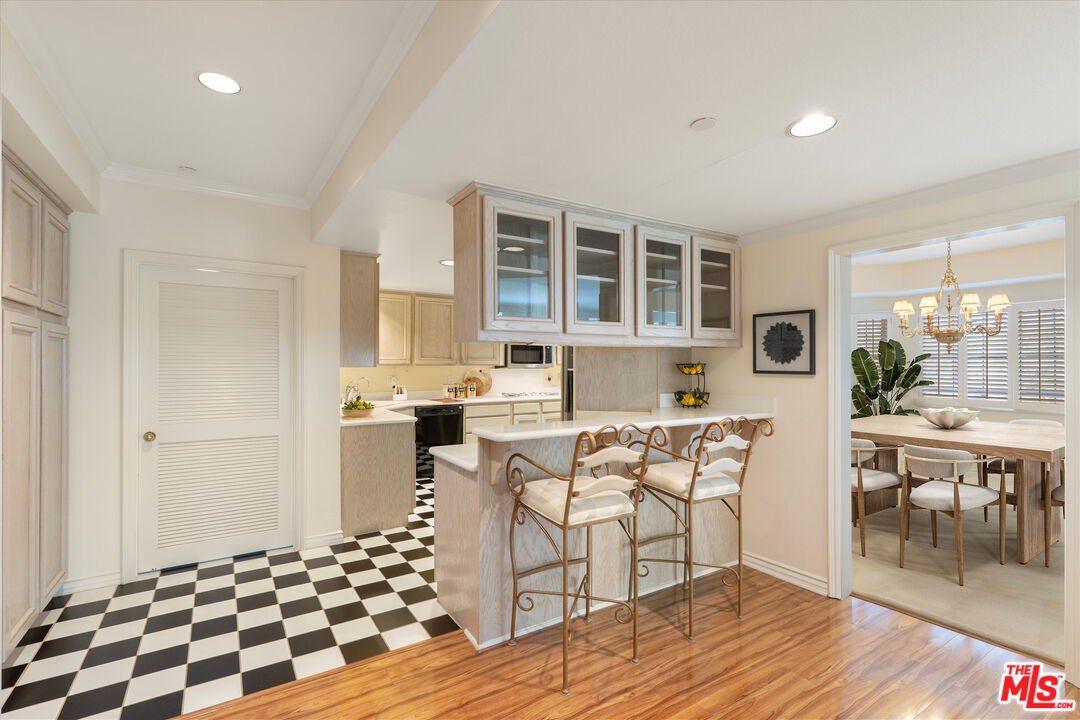 4310 Cahuenga Boulevard, Unit 304 Toluca Lake, CA 91602 - Photo 4 of 35 a living room with furniture and wooden floor
