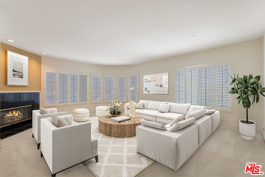 4310 Cahuenga Boulevard, Unit 304 Toluca Lake, CA 91602 - Photo 10 of 35 a living room with furniture and a potted plant