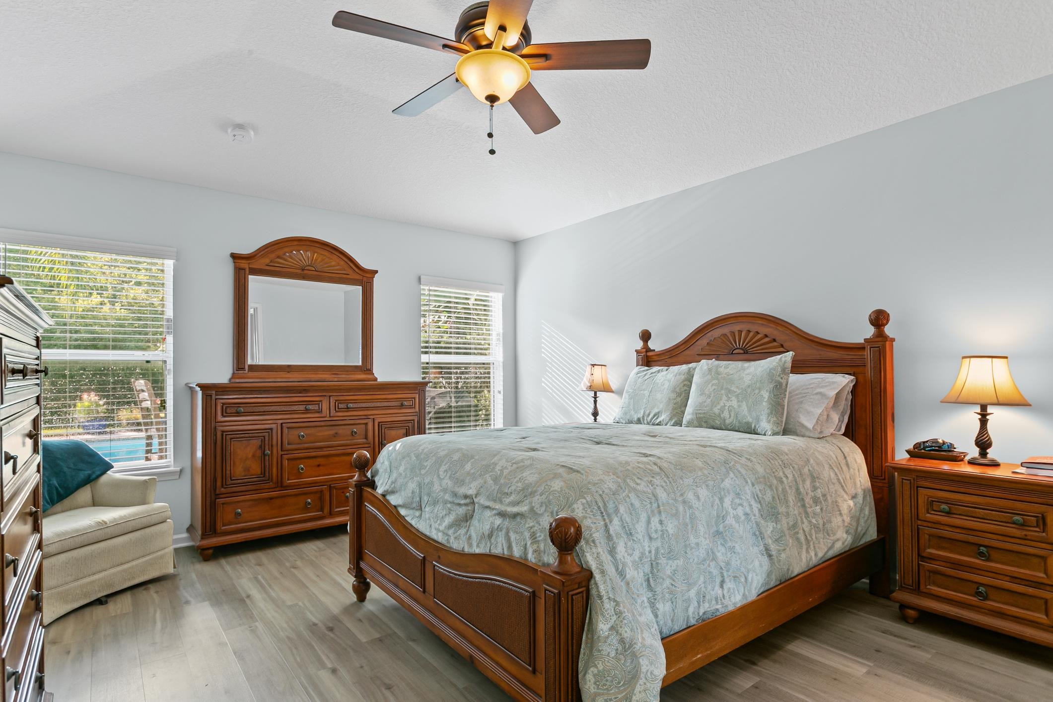 2724 North Portofino Road St. Augustine, FL 32092 - Photo 37 of 86 Bedroom featuring light wood finished floors, a ceiling fan, and a textured ceiling