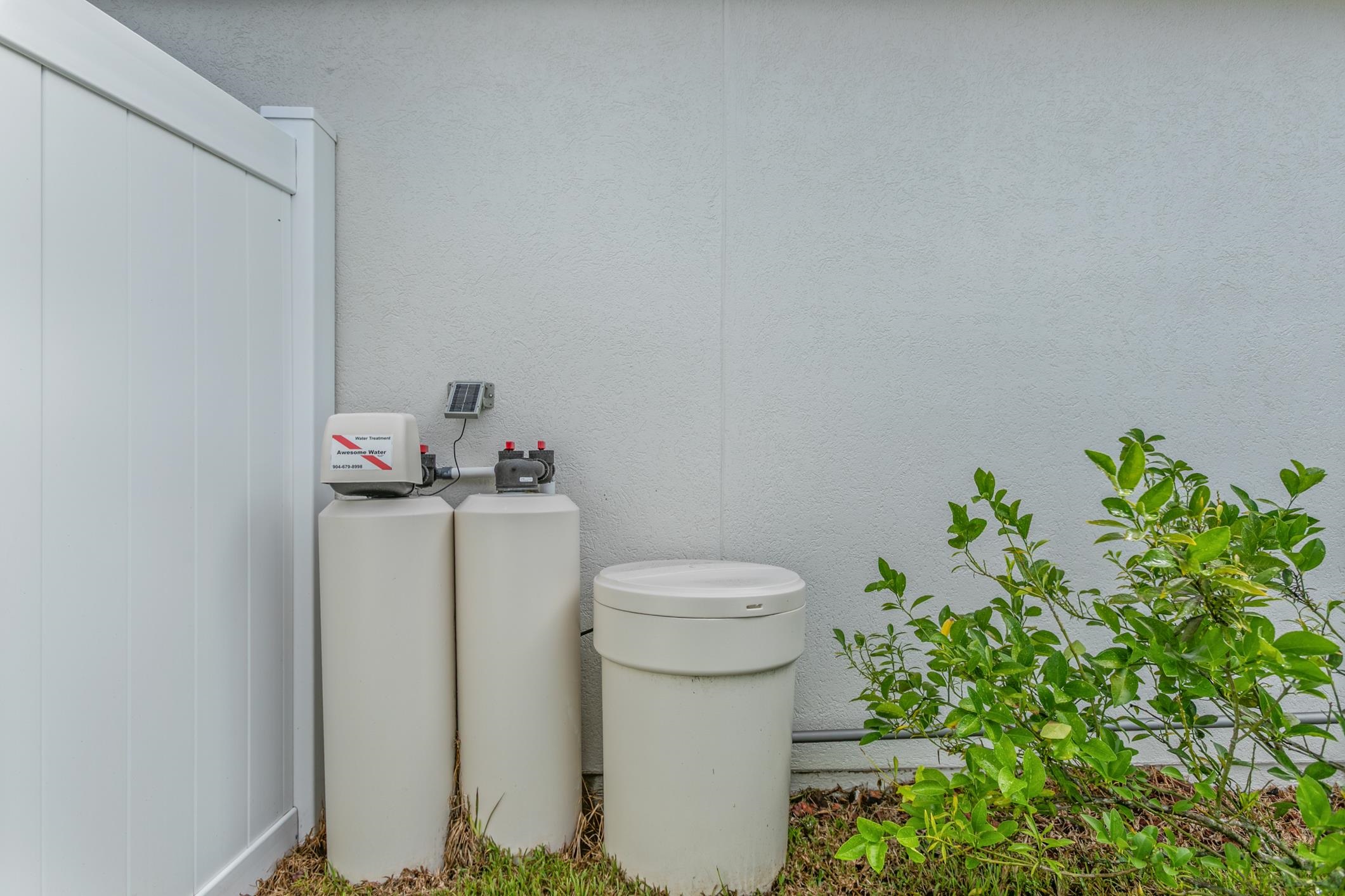 2724 North Portofino Road St. Augustine, FL 32092 - Photo 69 of 86 Exterior view of a water softener and stucco siding