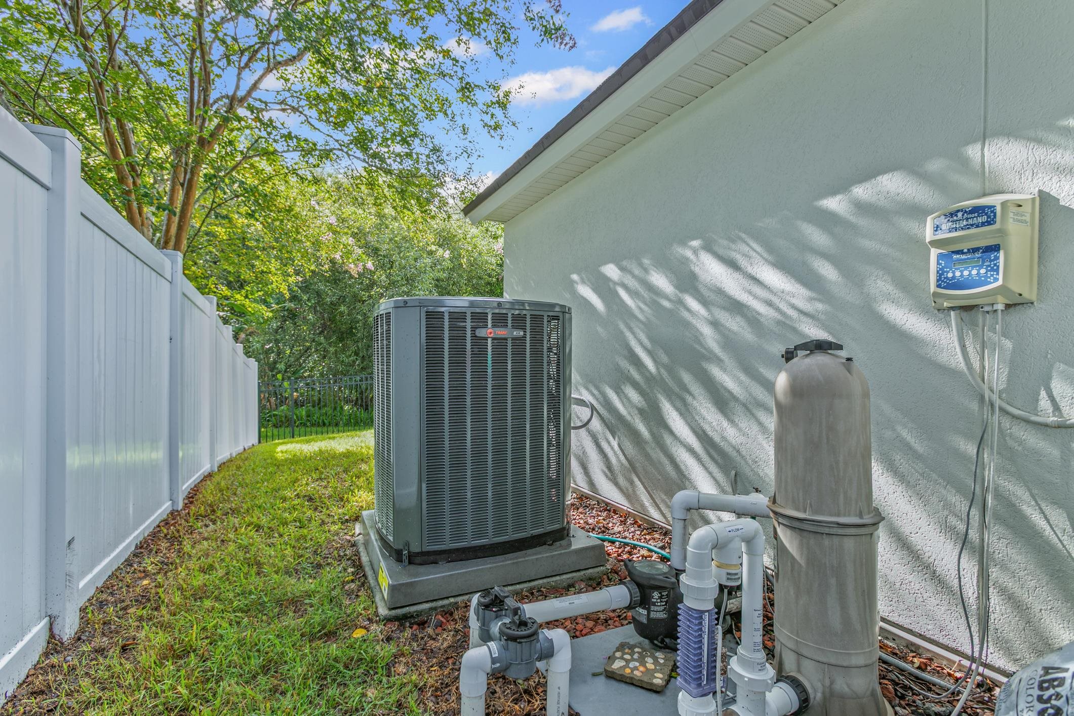2724 North Portofino Road St. Augustine, FL 32092 - Photo 70 of 86 Exterior view of a central AC unit and stucco siding