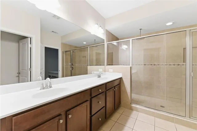 a bathroom with a shower and a shower