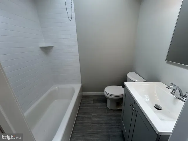 a hallway with table and chairs