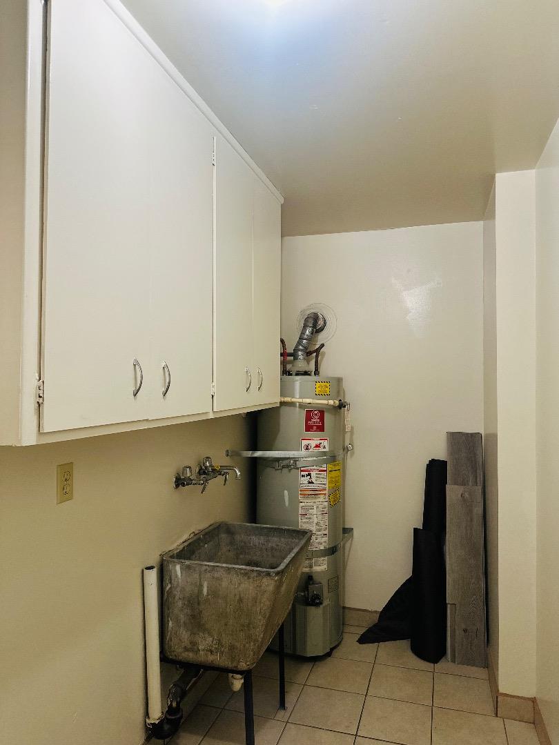 1707 West Swain Road, Unit 10 Stockton, CA 95207 - Photo 15 of 18 a room with storage and utility