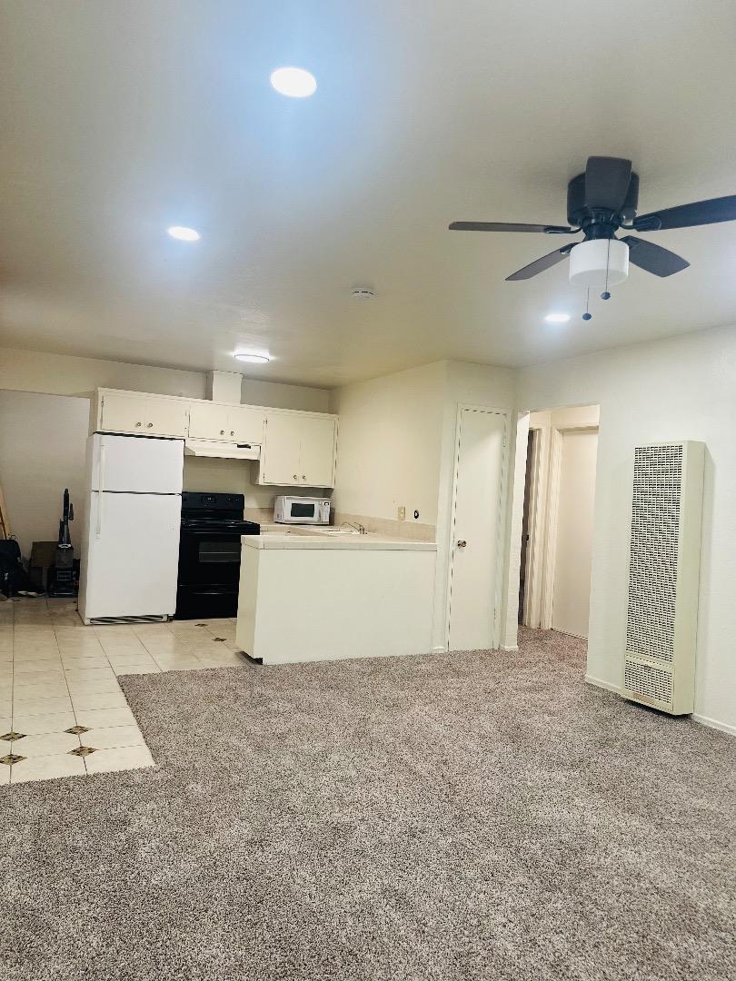 1707 West Swain Road, Unit 10 Stockton, CA 95207 - Photo 16 of 18 a view of a kitchen with a sink and dishwasher cabinets