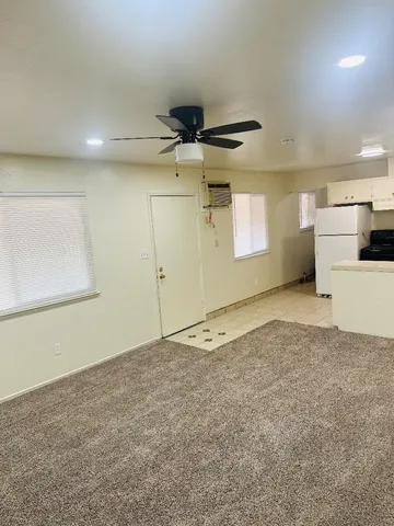a view of a kitchen with a sink and cabinets