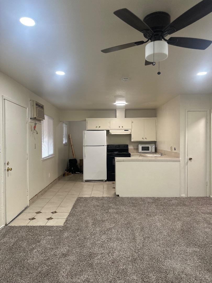 1707 West Swain Road, Unit 10 Stockton, CA 95207 - Photo 18 of 18 a view of a kitchen with a sink and cabinets
