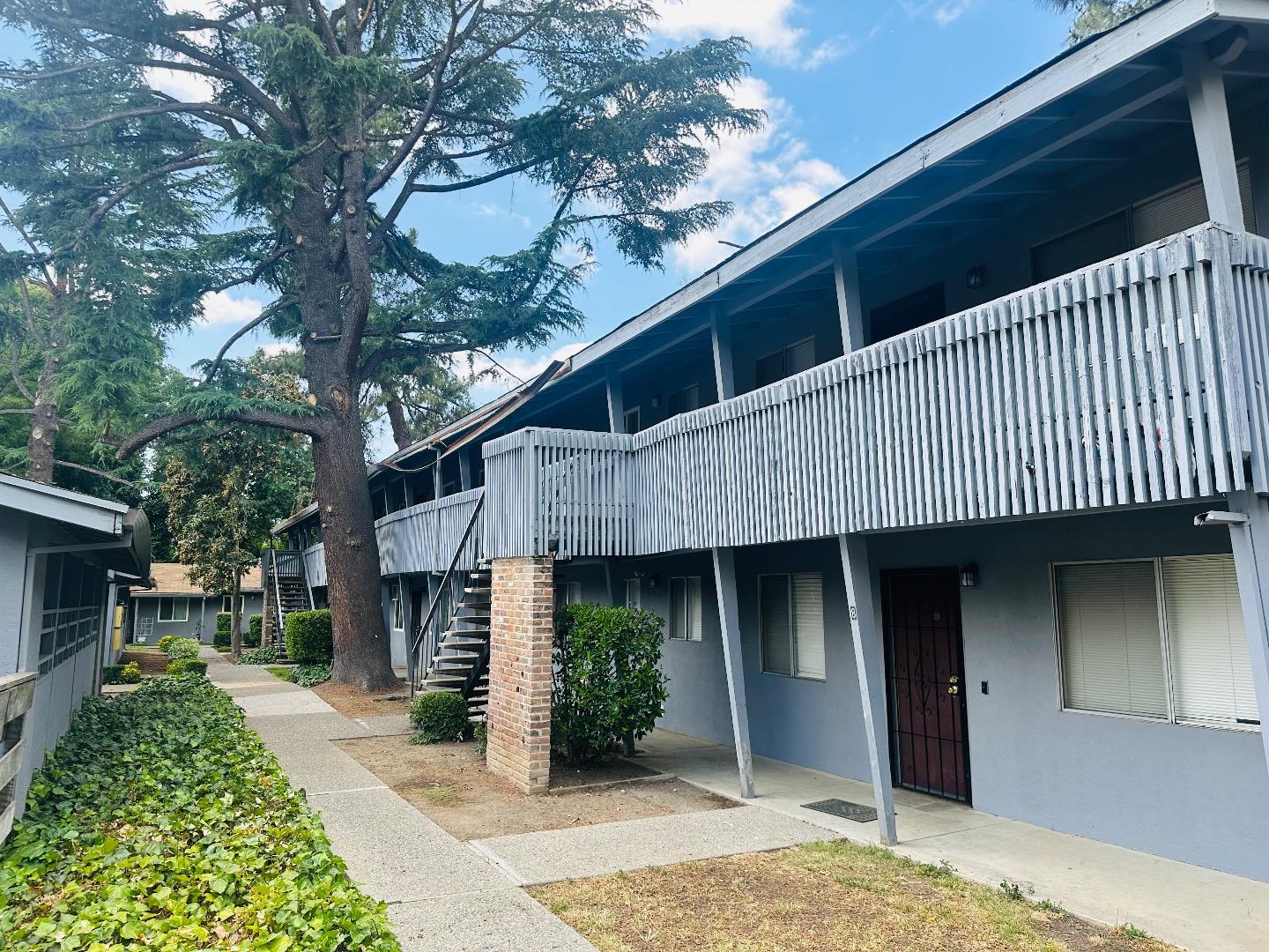 1707 West Swain Road, Unit 10 Stockton, CA 95207 - Photo 3 of 18 a front view of a house with a yard