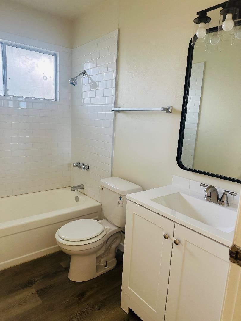1707 West Swain Road, Unit 10 Stockton, CA 95207 - Photo 6 of 18 a bathroom with a sink toilet and shower