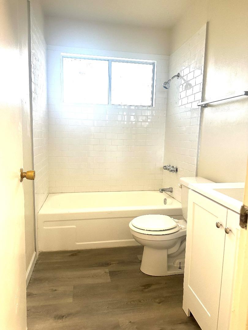 1707 West Swain Road, Unit 10 Stockton, CA 95207 - Photo 7 of 18 a bathroom with a toilet a sink and a bathtub