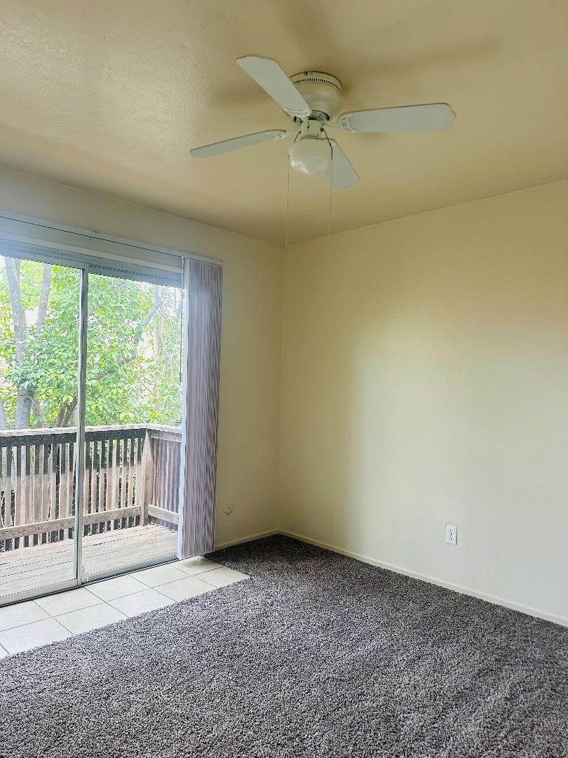 1707 West Swain Road, Unit 10 Stockton, CA 95207 - Photo 8 of 18 en empty room with windows