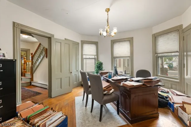 a view of a livingroom with furniture window and wooden floor