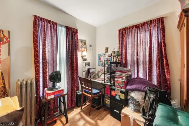 a view of a livingroom with furniture and a window