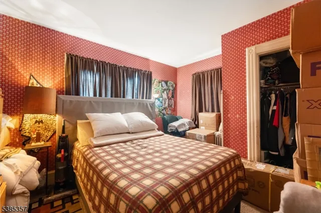 a bedroom with a bed and a closet