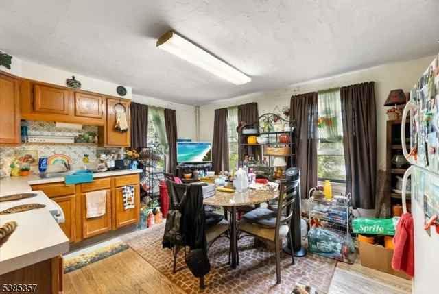 a view of a dining room with furniture window and outdoor kitchen