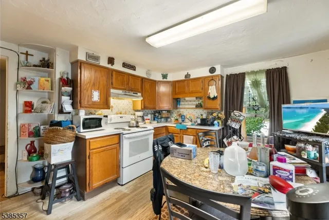 a living room with fireplace furniture and a flat screen tv