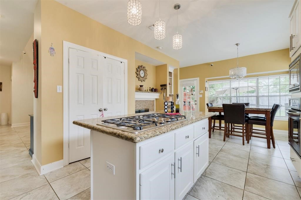 14103 Heatherhill Place Houston, TX 77077 - Photo 11 of 47 a kitchen with a table and chairs in it