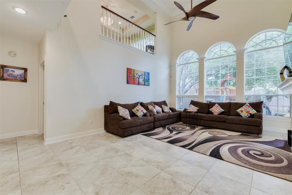 14103 Heatherhill Place Houston, TX 77077 - Photo 17 of 47 a living room with furniture and a large window