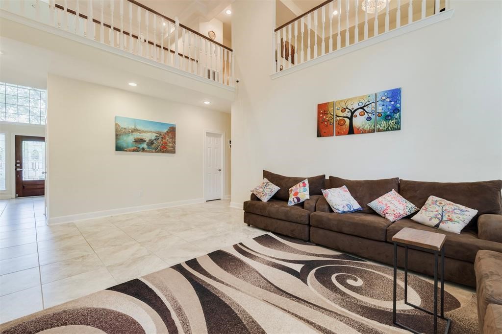14103 Heatherhill Place Houston, TX 77077 - Photo 20 of 47 a living room with furniture and a rug