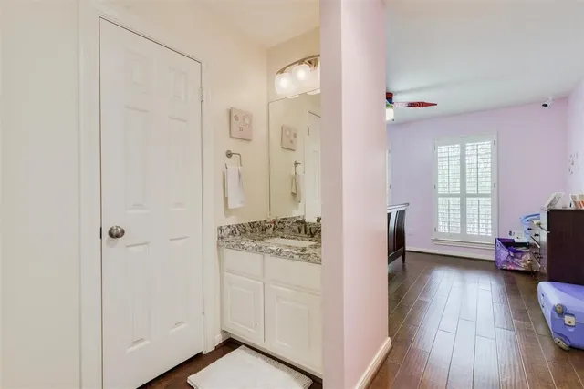 a view of kitchen with livingroom and hardwood floor