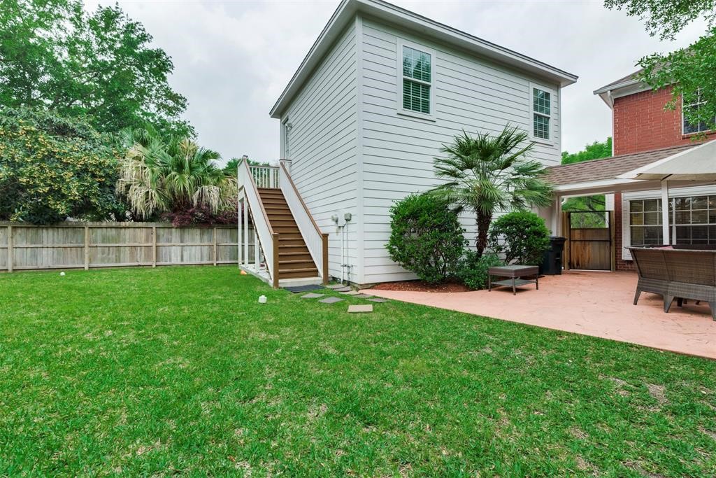 14103 Heatherhill Place Houston, TX 77077 - Photo 41 of 47 a view of a house with a backyard
