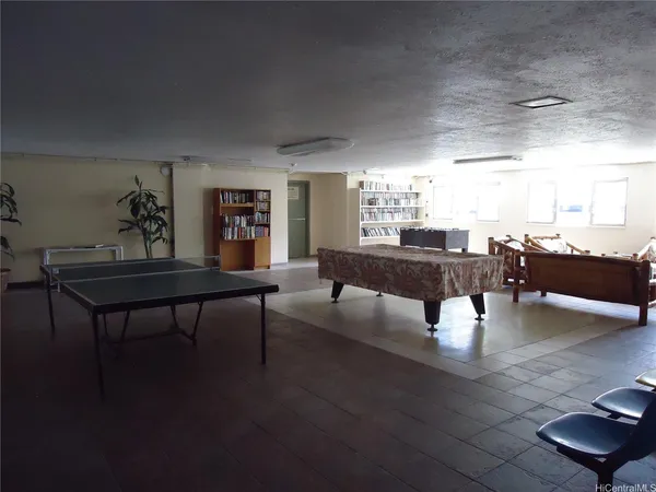 a large white kitchen with a stove a sink dishwasher and a refrigerator