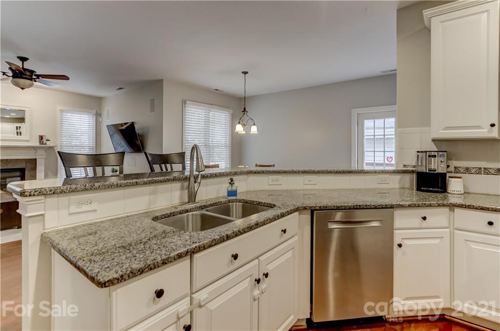 1178 Market Street Fort Mill, SC 29708 - Photo 15 of 47 a kitchen with granite countertop a sink and white cabinets
