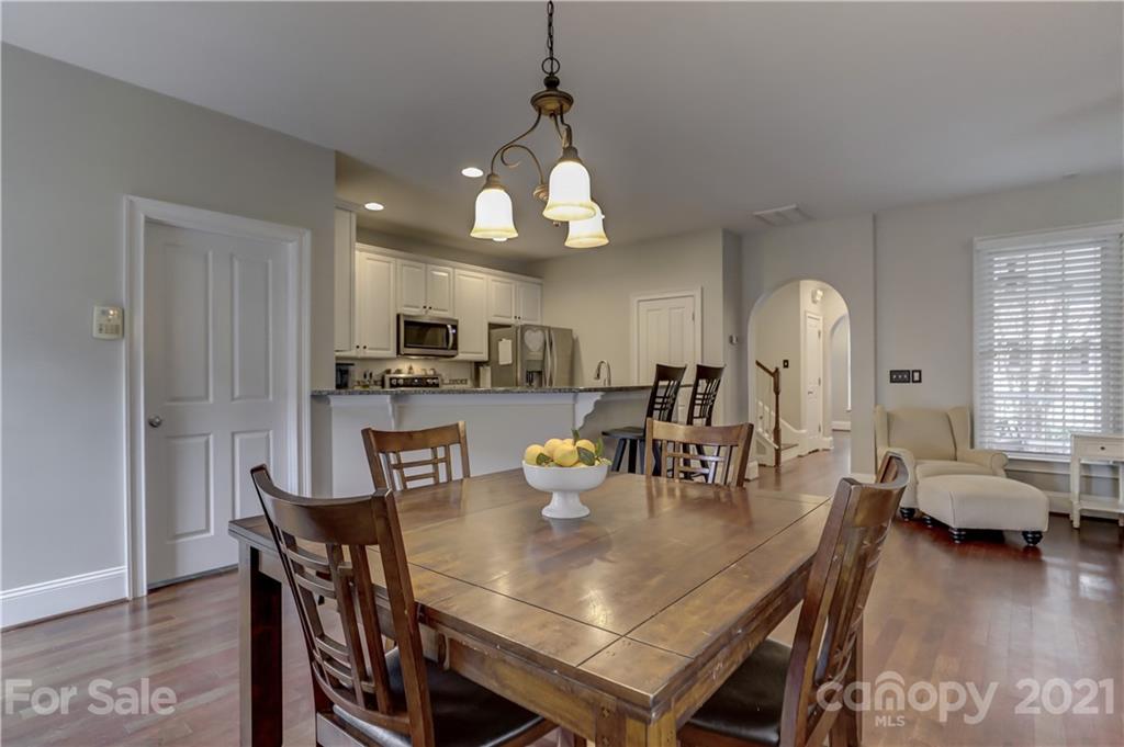 1178 Market Street Fort Mill, SC 29708 - Photo 20 of 47 a view of a dining room with furniture and wooden floor