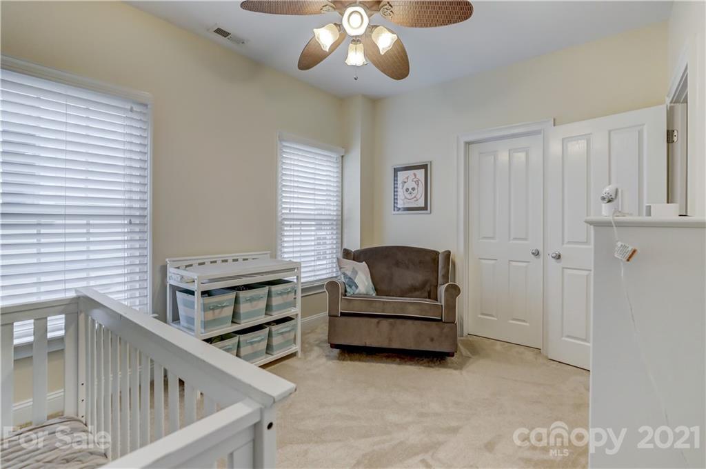 1178 Market Street Fort Mill, SC 29708 - Photo 34 of 47 a living room with furniture and a chandelier