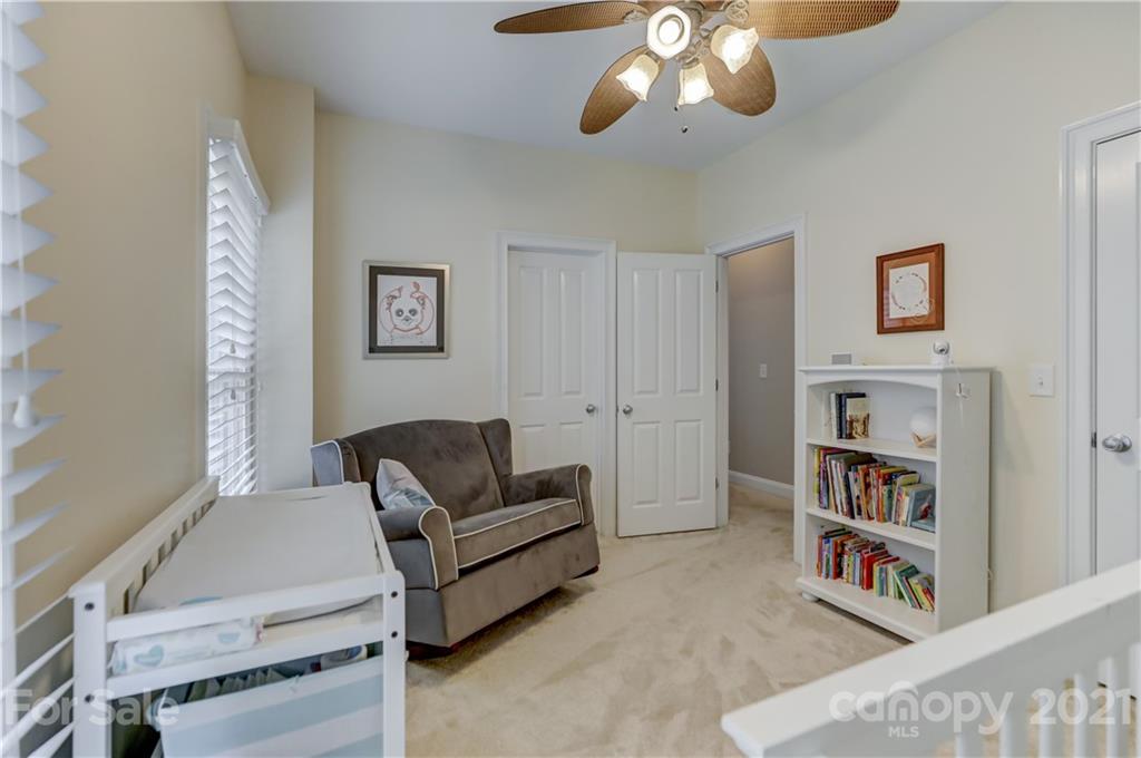 1178 Market Street Fort Mill, SC 29708 - Photo 35 of 47 a living room with furniture and a bookshelf