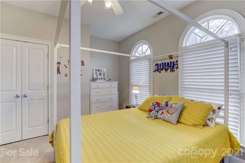 1178 Market Street Fort Mill, SC 29708 - Photo 40 of 47 a bedroom with a bed and a chandelier