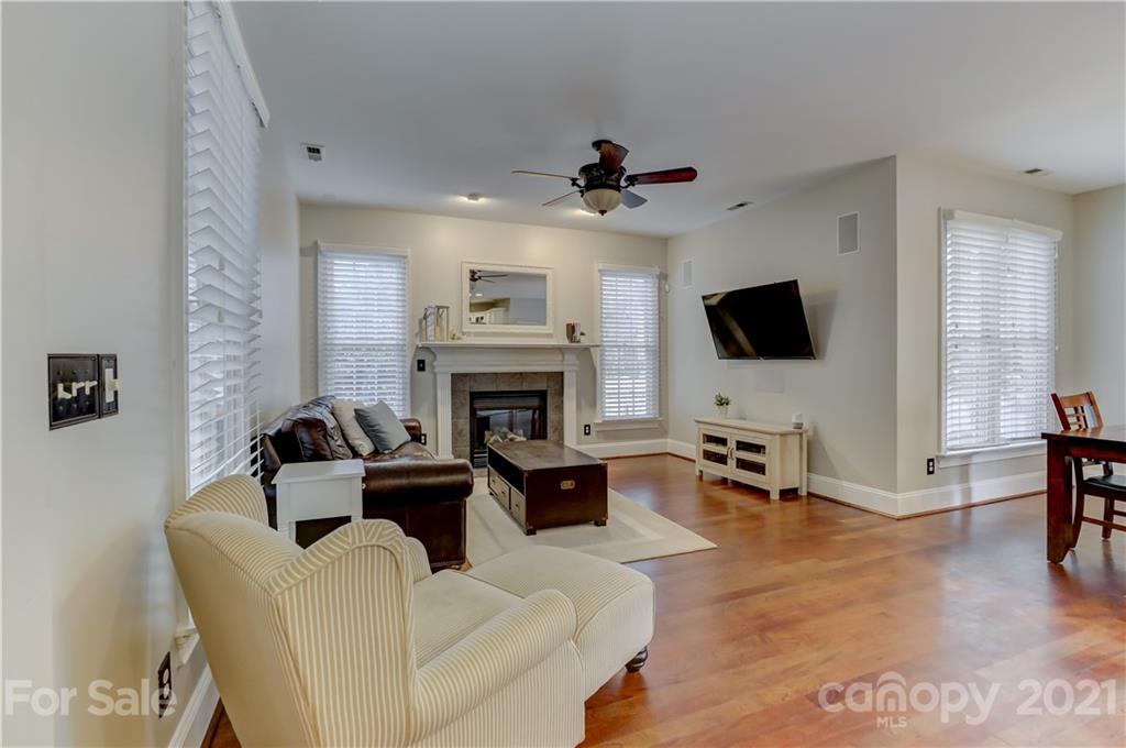1178 Market Street Fort Mill, SC 29708 - Photo 9 of 47 a living room with furniture a fireplace and a flat screen tv