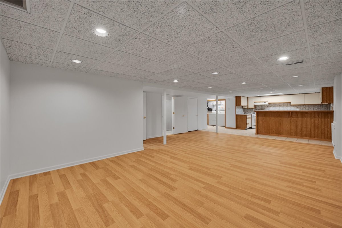 1427 Busse Road Mount Prospect, IL 60056 - Photo 20 of 38 a view of empty room with wooden floor