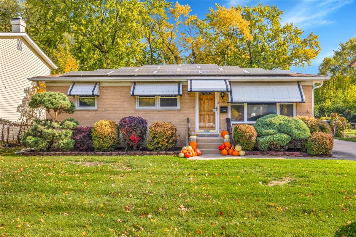 1427 Busse Road Mount Prospect, IL 60056 - Photo 2 of 38 a view of front house with garden