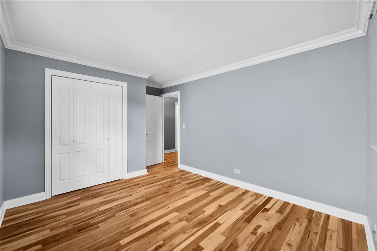 1427 Busse Road Mount Prospect, IL 60056 - Photo 24 of 38 a view of a room with wooden floor