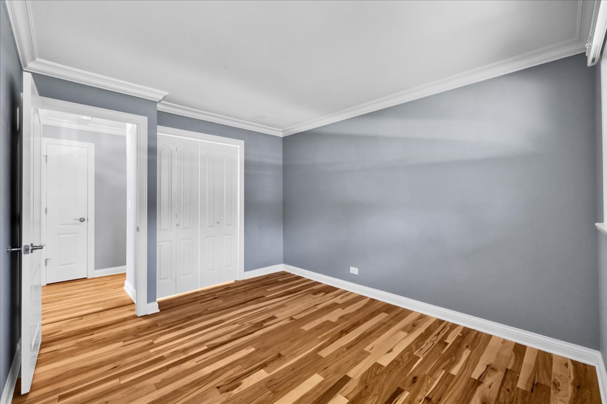 1427 Busse Road Mount Prospect, IL 60056 - Photo 28 of 38 a view of a room with wooden floor