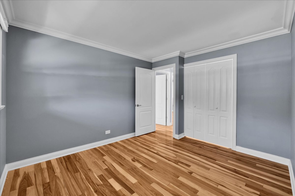 1427 Busse Road Mount Prospect, IL 60056 - Photo 30 of 38 a view of a room with wooden floor