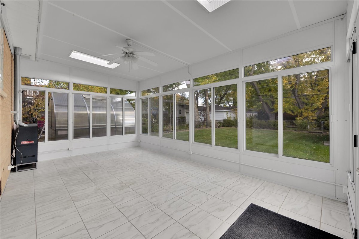 1427 Busse Road Mount Prospect, IL 60056 - Photo 32 of 38 a view of an empty room with a large window