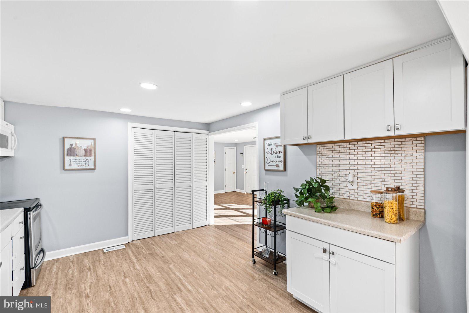 27 Truslow Road Fredericksburg, VA 22405 - Photo 11 of 35 a bedroom with a bed and a potted plant