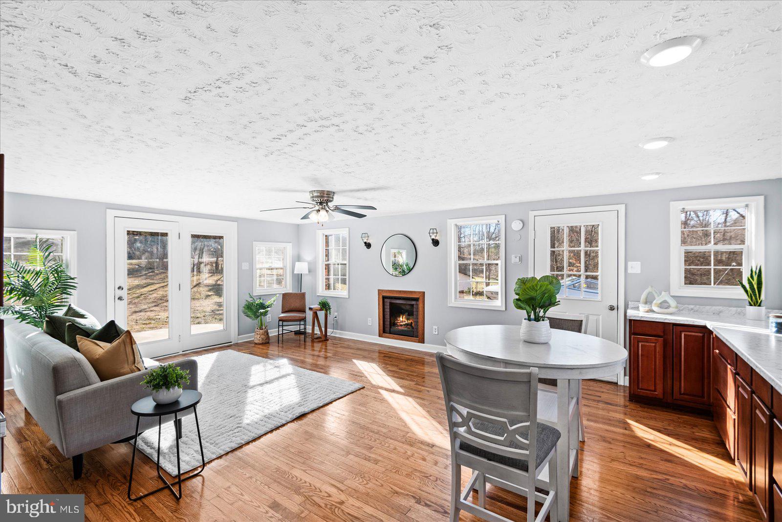 27 Truslow Road Fredericksburg, VA 22405 - Photo 14 of 35 a living room with fireplace furniture and a large window