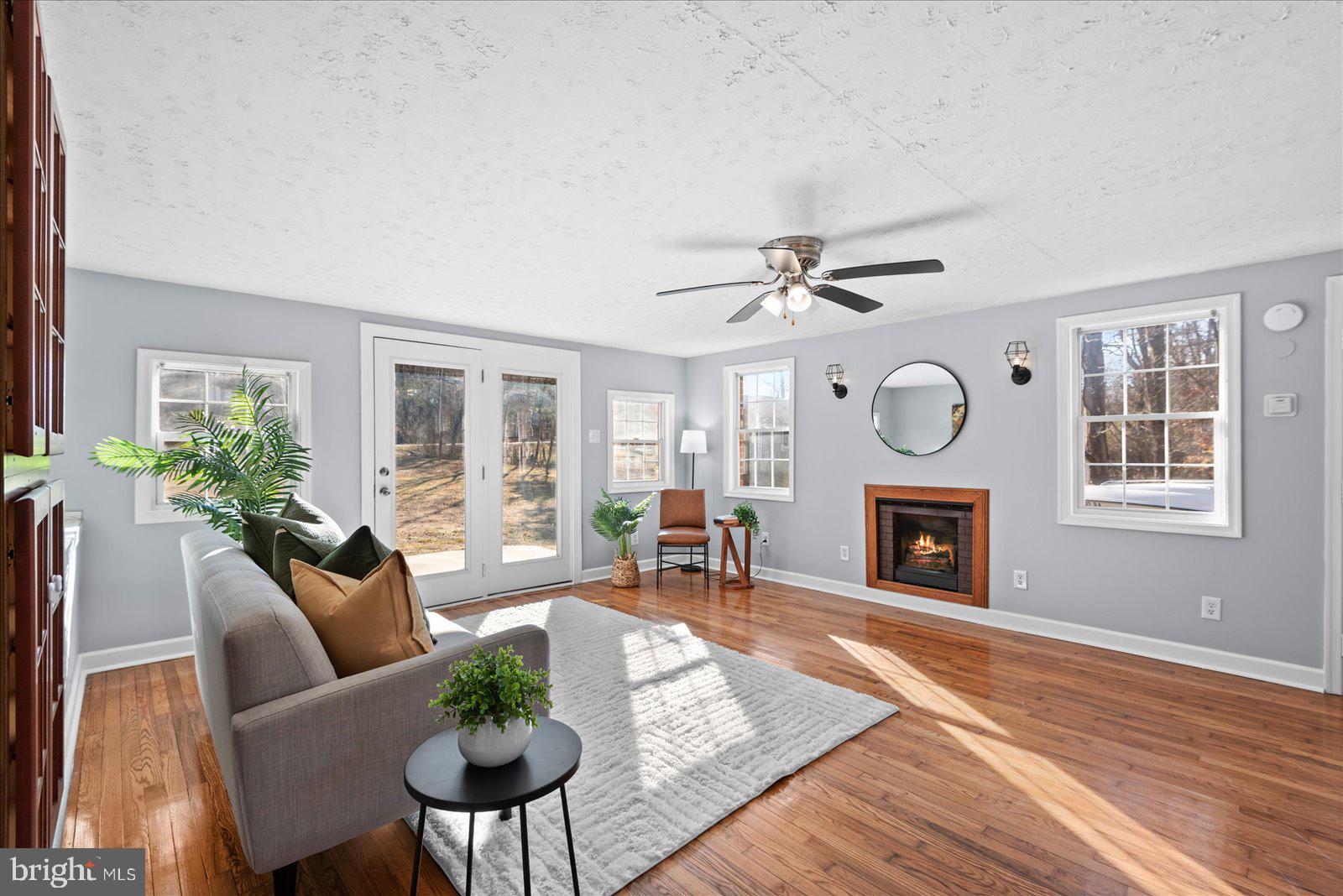27 Truslow Road Fredericksburg, VA 22405 - Photo 15 of 35 a living room with furniture a window and a fireplace