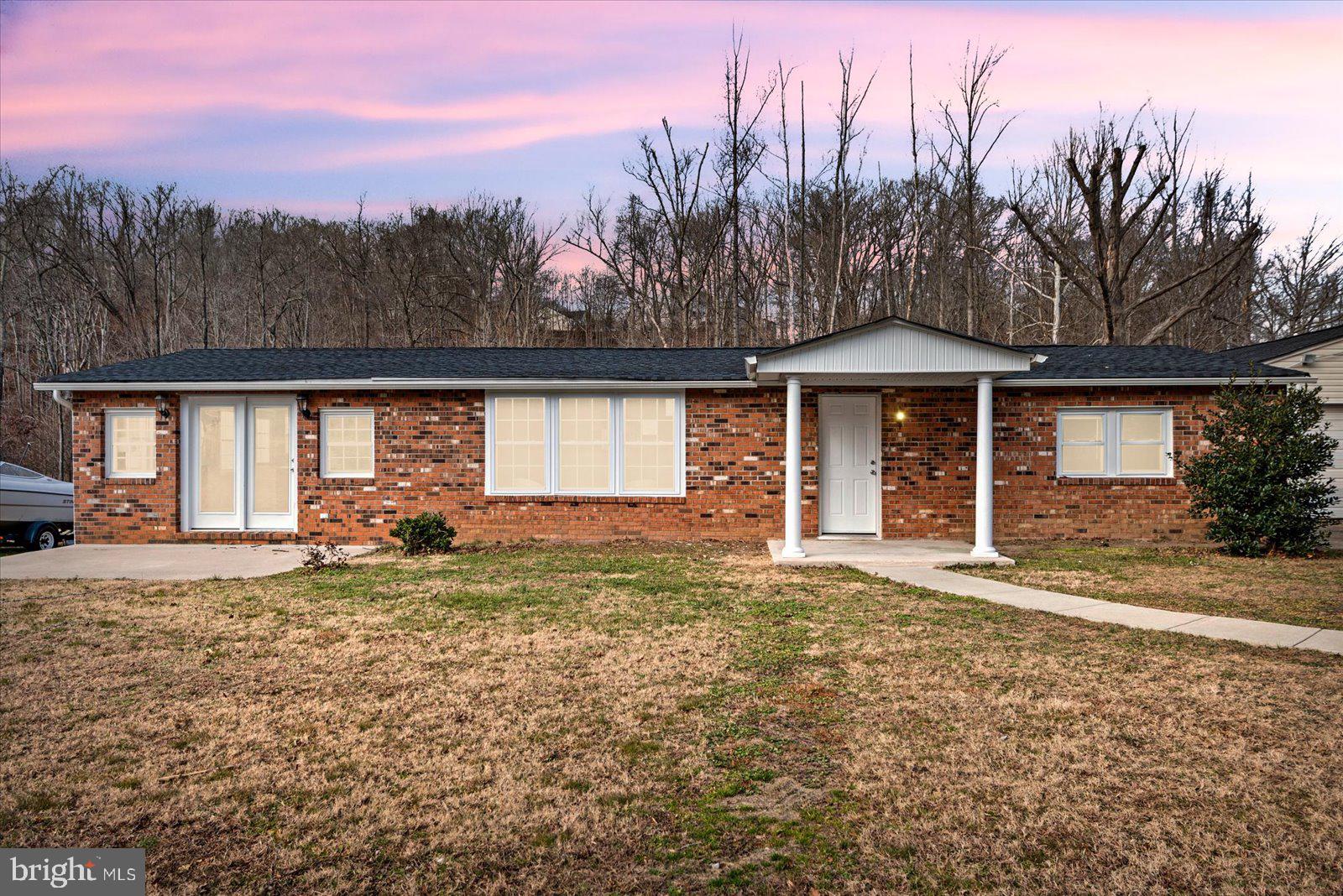 27 Truslow Road Fredericksburg, VA 22405 - Photo 2 of 35 a big house with a big yard and large trees