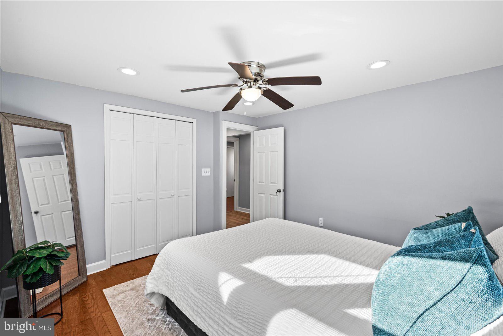 27 Truslow Road Fredericksburg, VA 22405 - Photo 21 of 35 a bedroom with a bed and a chandelier