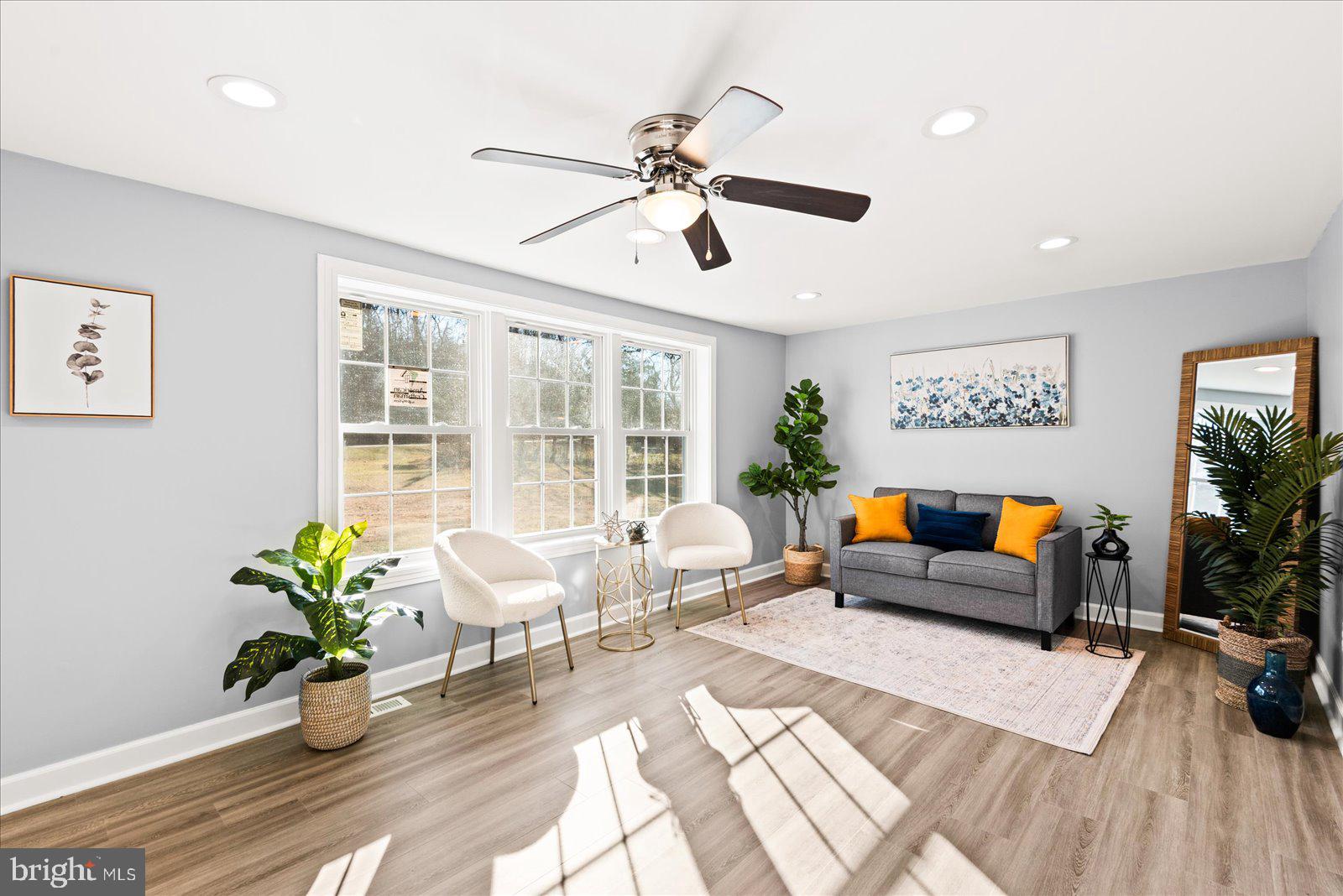 27 Truslow Road Fredericksburg, VA 22405 - Photo 5 of 35 a living room with furniture and potted plant with wooden floor