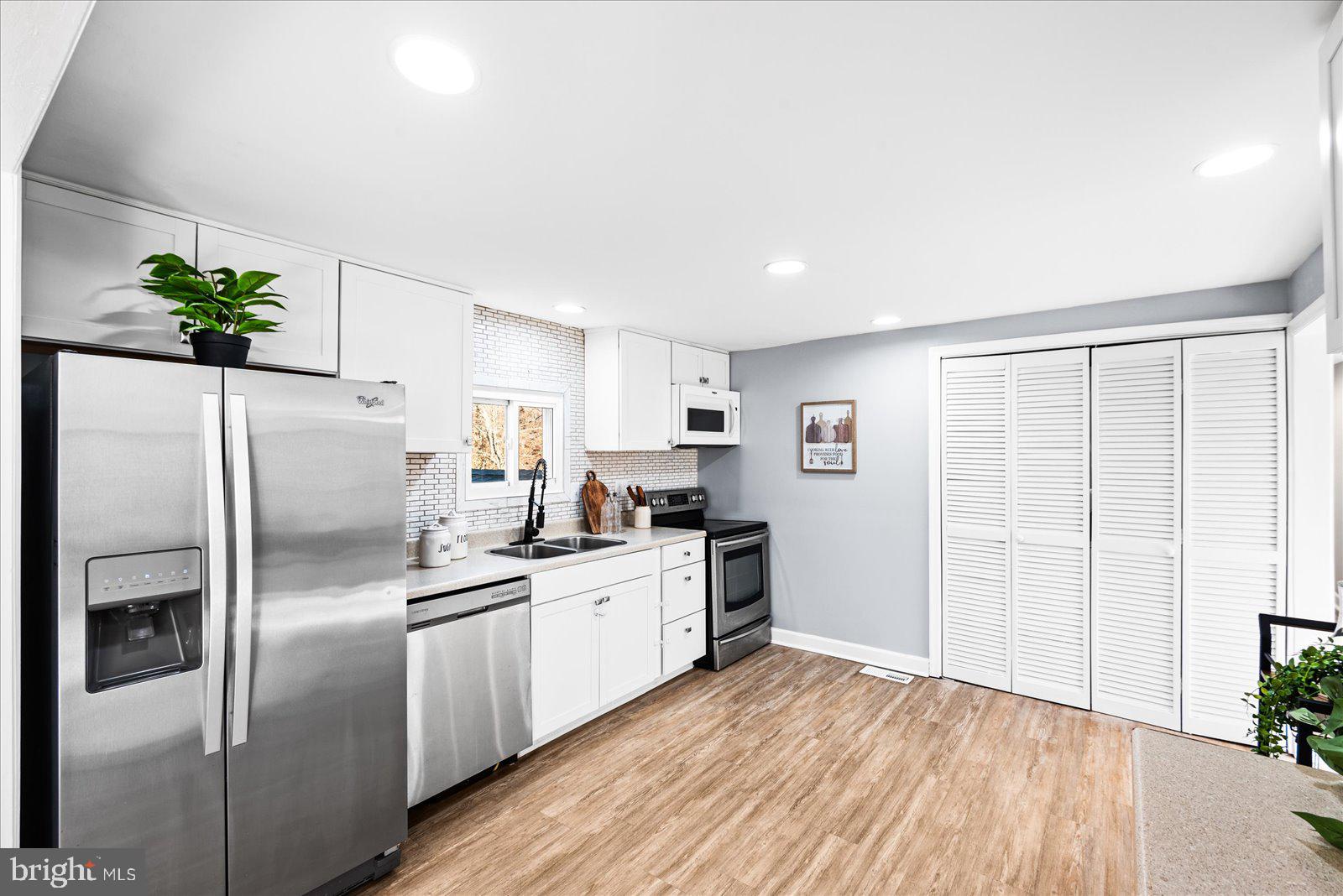 27 Truslow Road Fredericksburg, VA 22405 - Photo 10 of 35 a kitchen with stainless steel appliances a refrigerator sink and stove
