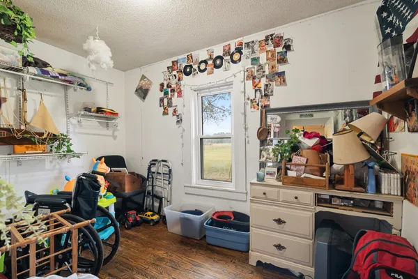 a bedroom with furniture and a window