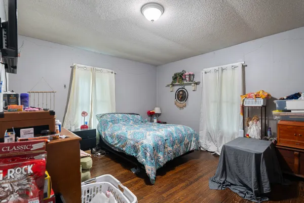 a bedroom with bed and a window