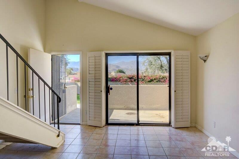 34404 Laura Way Rancho Mirage, CA 92270 - Photo 2 of 31 a view of a hallway with staircase